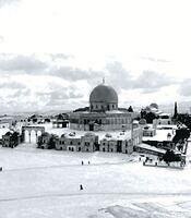 Dome of the Rock in Al-Aqsa Mosque in Jerusalem, Palestine covered with snow in 1920